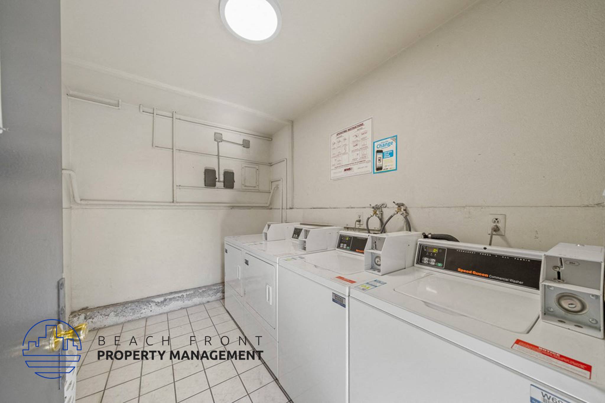 an image of a laundry room with white appliances